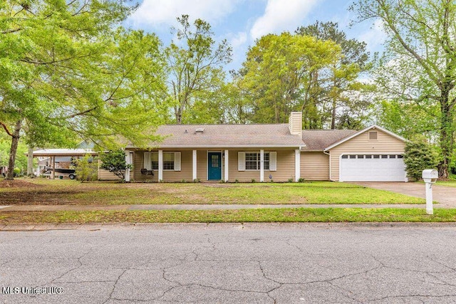 139 Booth Cir, Ocean Springs, MS 39564 - ranch-style house with a chimney, an attached garage, driveway, and a front lawn