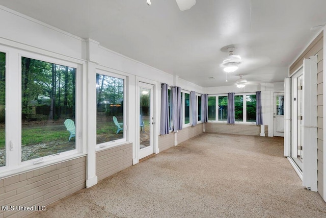 139 Booth Cir, Ocean Springs, MS 39564 - unfurnished sunroom featuring healthy amount of natural light, brick wall, and carpet floors