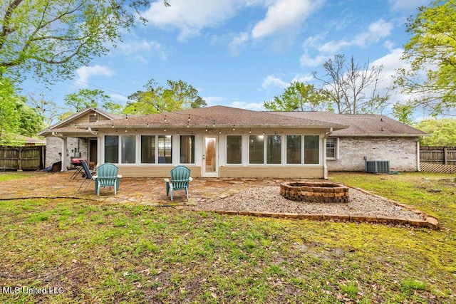 139 Booth Cir, Ocean Springs, MS 39564 - back of property featuring an outdoor fire pit, brick siding, a sunroom, and a patio