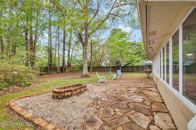 139 Booth Cir, Ocean Springs, MS 39564 - fenced backyard featuring an outdoor fire pit and a patio area