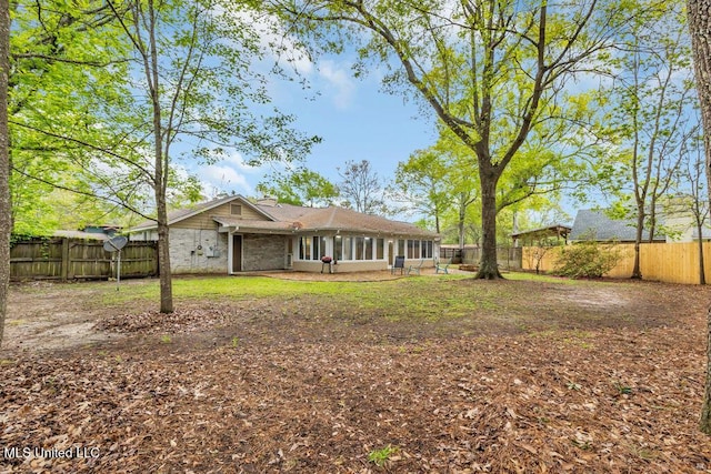 139 Booth Cir, Ocean Springs, MS 39564 - back of property with a fenced backyard and a chimney