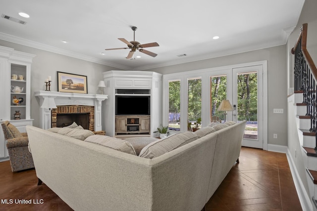 living room with visible vents, recessed lighting, a ceiling fan, a brick fireplace, and stairway