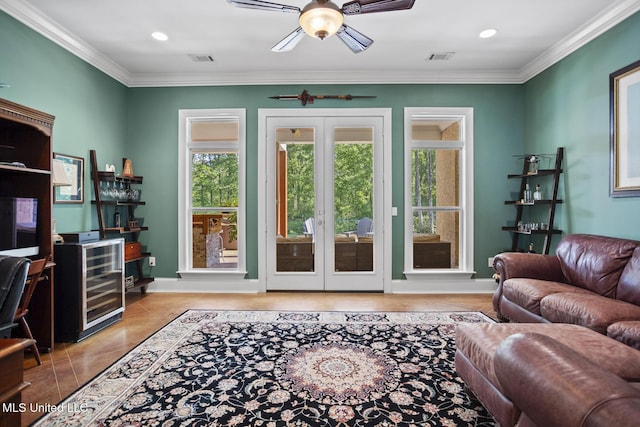 living room with ornamental molding, wine cooler, french doors, and ceiling fan