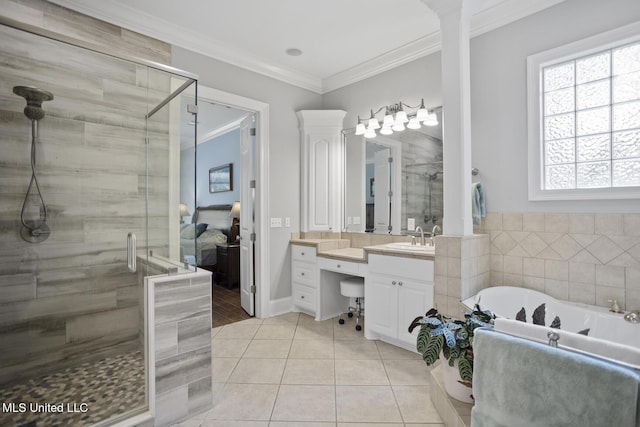bathroom with tile patterned flooring, a freestanding bath, vanity, ornamental molding, and a stall shower