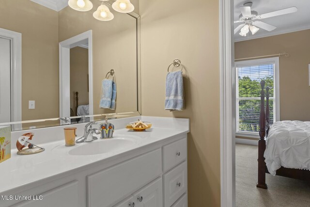 bathroom featuring ceiling fan with notable chandelier, ensuite bathroom, vanity, and ornamental molding