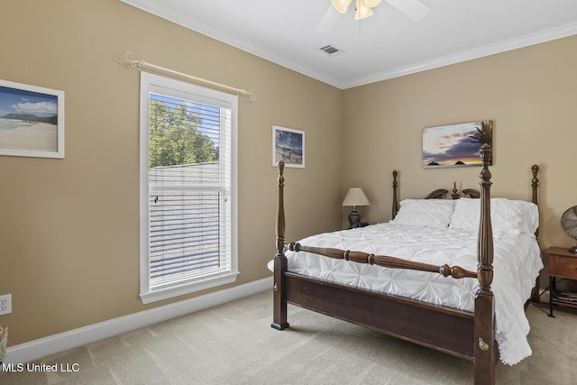 carpeted bedroom featuring a ceiling fan, baseboards, ornamental molding, and visible vents