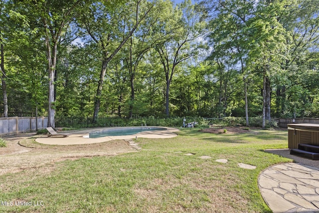 view of yard featuring an outdoor pool, a patio area, a hot tub, and a fenced backyard