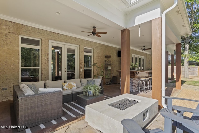 view of patio / terrace featuring french doors, an outdoor living space with a fire pit, fence, outdoor dry bar, and a ceiling fan