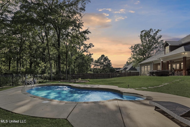 pool at dusk with a fenced backyard, a patio area, a fenced in pool, and a lawn