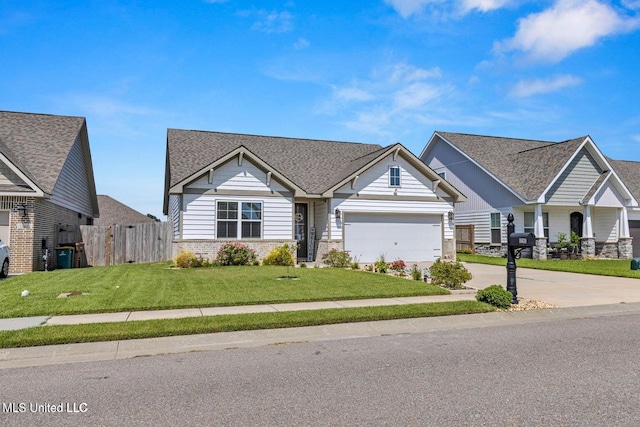 craftsman-style house with a front yard, concrete driveway, fence, an attached garage, and brick siding
