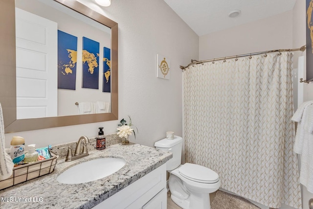 bathroom featuring a shower with curtain, toilet, and vanity