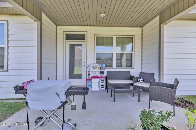 view of patio featuring covered porch, grilling area, and outdoor lounge area