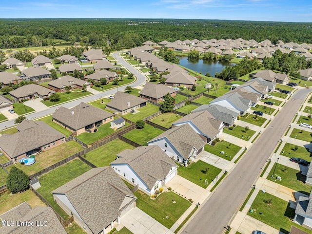 birds eye view of property with a residential view and a water view