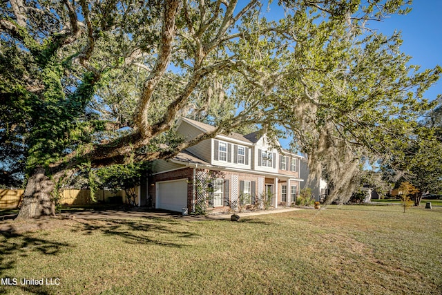 view of front facade with a front lawn and a garage