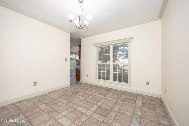 spare room featuring ornamental molding and a chandelier