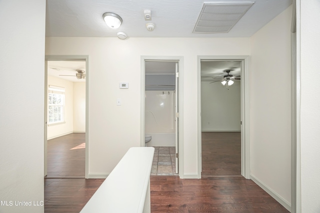 corridor with dark wood-type flooring