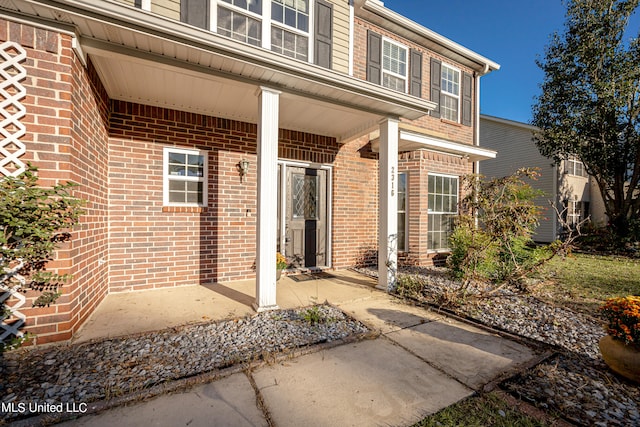 property entrance featuring a porch