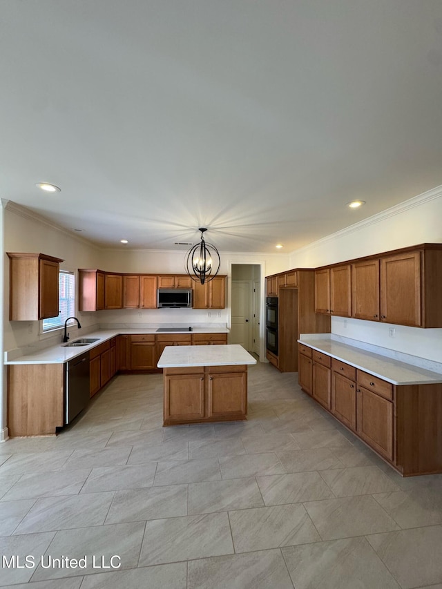 kitchen with sink, a center island, ornamental molding, black appliances, and a chandelier