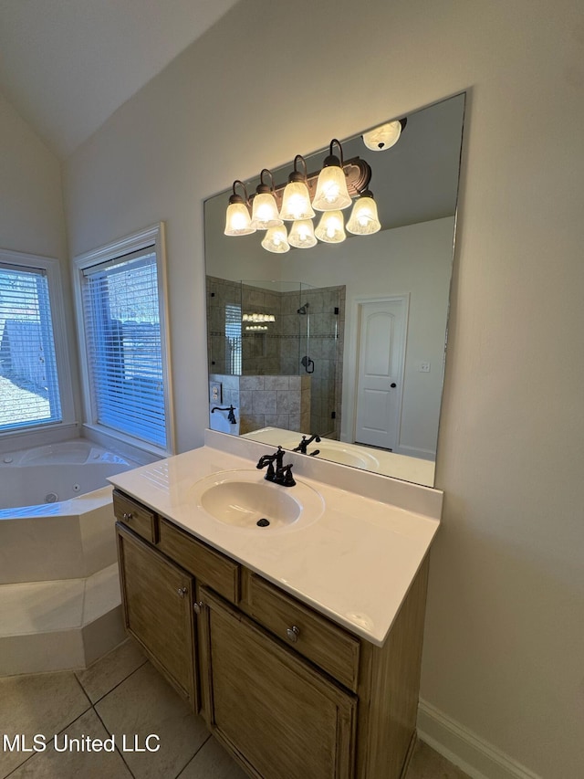 bathroom featuring tile patterned flooring, vanity, vaulted ceiling, and separate shower and tub