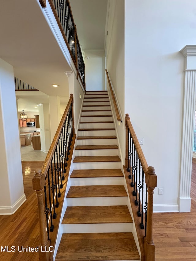 stairs with wood-type flooring