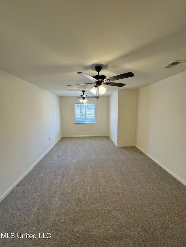 carpeted empty room featuring ceiling fan