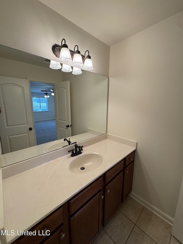 bathroom with tile patterned flooring and vanity