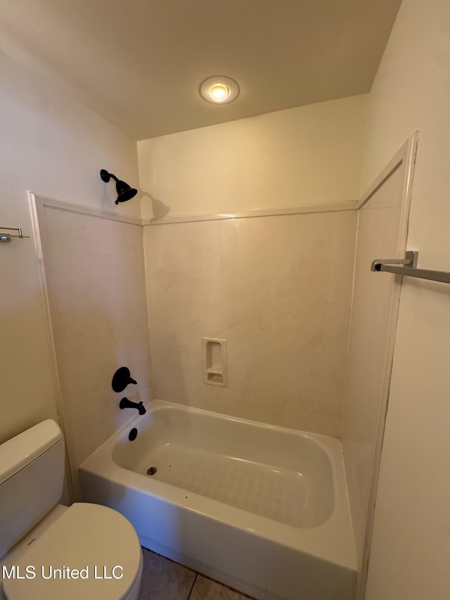 bathroom with tile patterned floors,  shower combination, and toilet