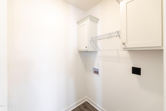 laundry room featuring washer hookup, electric dryer hookup, wood-type flooring, and cabinets