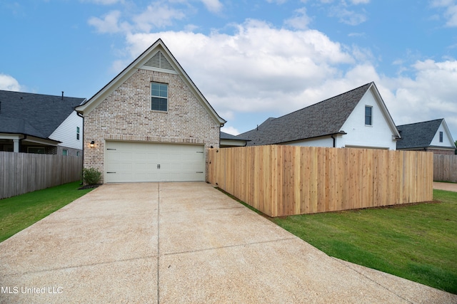 exterior space with a front yard and a garage