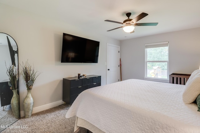 3927 Washington Ave, Gulfport, MS 39507 - carpeted bedroom with baseboards and ceiling fan