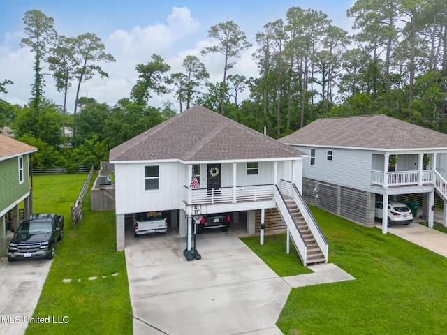 3927 Washington Ave, Gulfport, MS 39507 - beach home with roof with shingles, stairway, and driveway