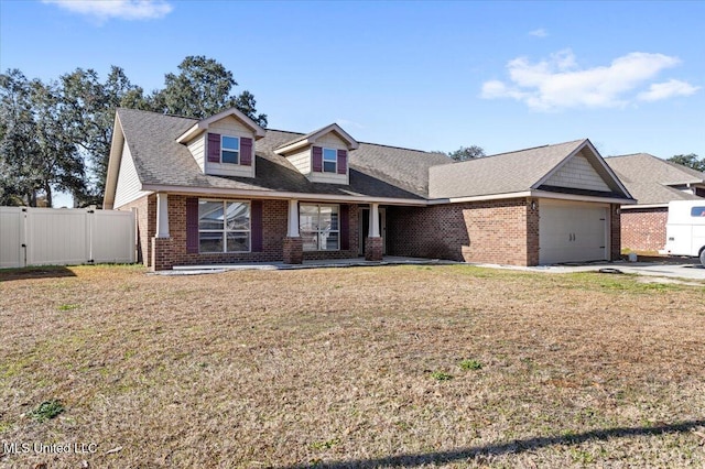 view of front of home with a garage and a front lawn