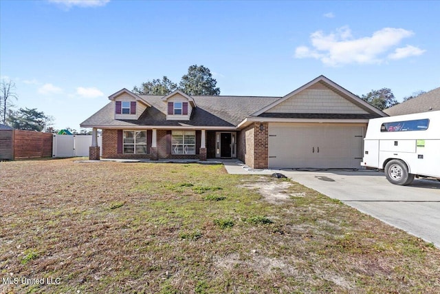 view of front of house with a garage and a front lawn