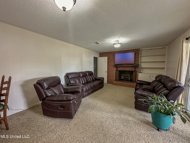 living room featuring carpet, a brick fireplace, and a textured ceiling