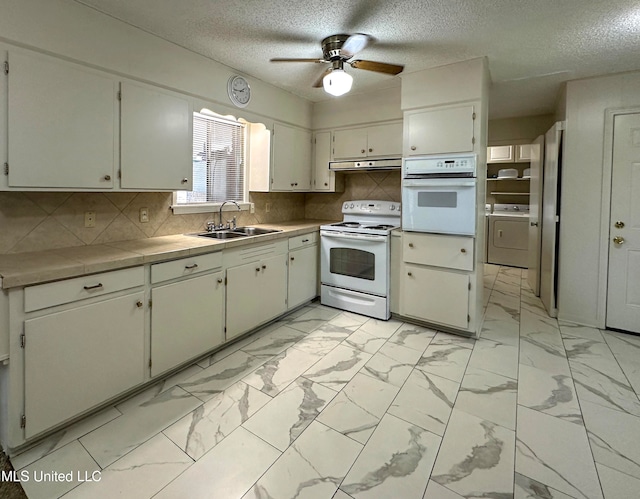 kitchen featuring white appliances, washer / clothes dryer, sink, ceiling fan, and decorative backsplash