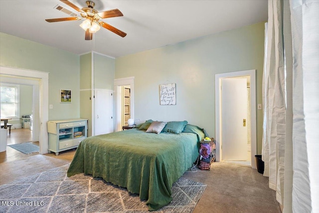 carpeted bedroom featuring ceiling fan