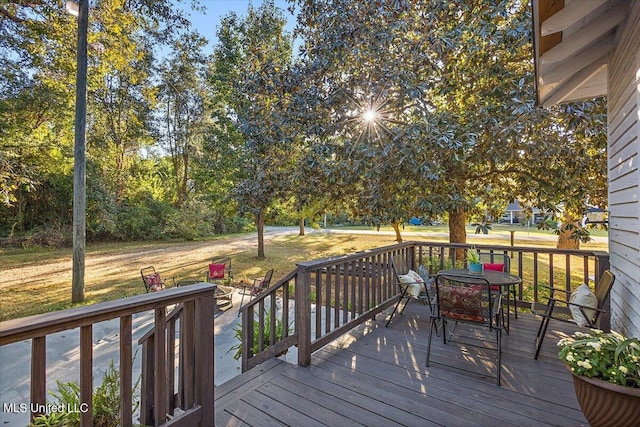 deck featuring a lawn