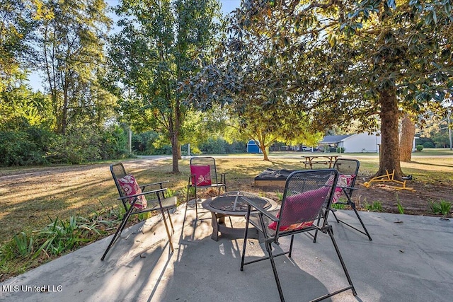 view of patio / terrace featuring a fire pit