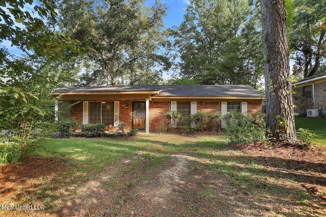 ranch-style home featuring a front yard