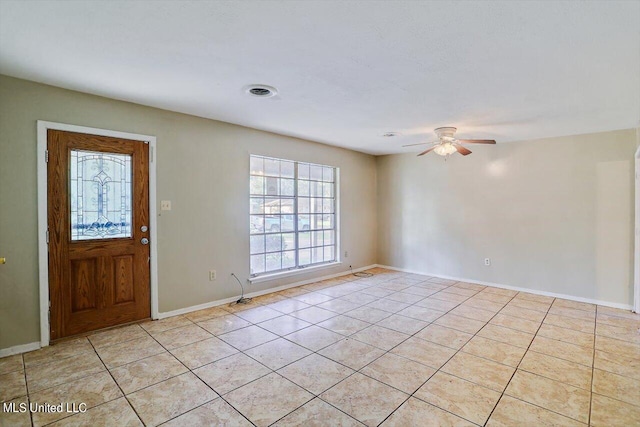 tiled foyer entrance with ceiling fan