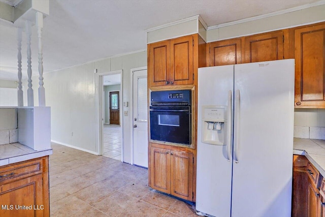 kitchen with tasteful backsplash, oven, white refrigerator with ice dispenser, crown molding, and light tile patterned floors