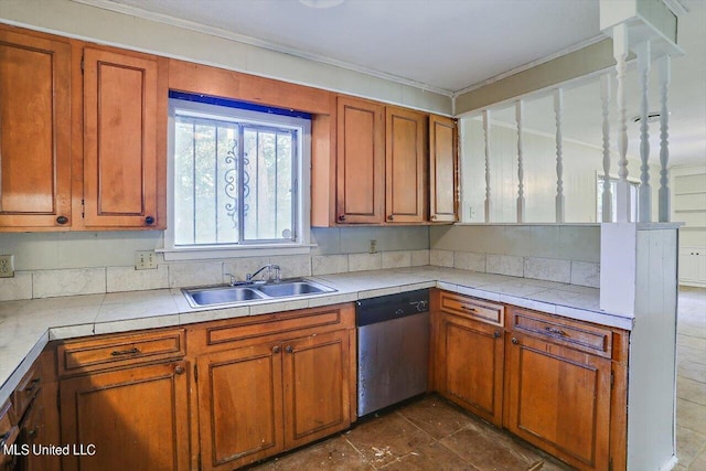 338 Lake Of Pines Dr, Jackson, MS 39206 - kitchen with brown cabinets, a sink, crown molding, and stainless steel dishwasher
