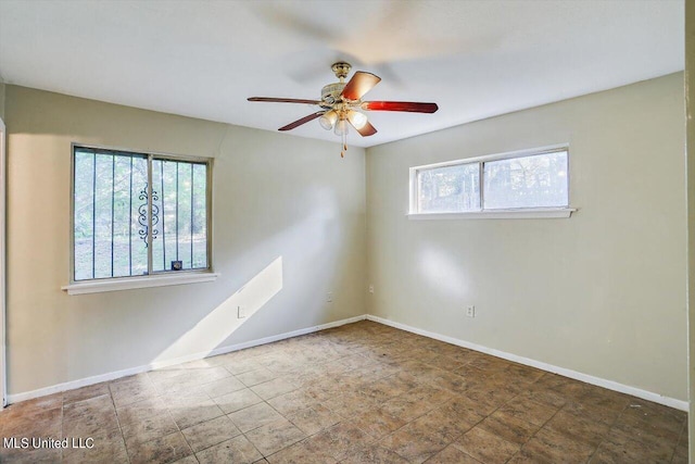 338 Lake Of Pines Dr, Jackson, MS 39206 - spare room featuring baseboards and ceiling fan