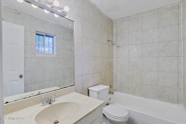 338 Lake Of Pines Dr, Jackson, MS 39206 - bathroom featuring vanity, toilet, tile walls, and  shower combination