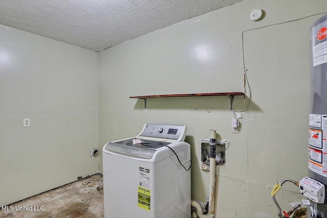 laundry room featuring washer / dryer and a textured ceiling