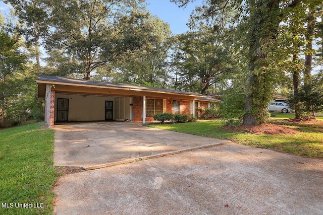 ranch-style house with a front yard and a carport