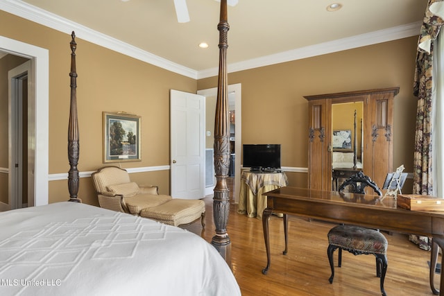 bedroom featuring hardwood / wood-style floors, crown molding, and ceiling fan