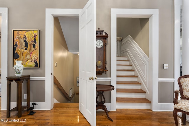 stairs with hardwood / wood-style flooring