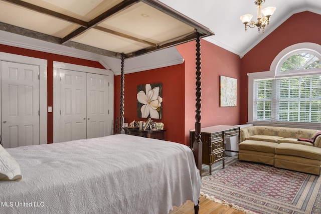 bedroom with wood-type flooring, an inviting chandelier, and vaulted ceiling with beams