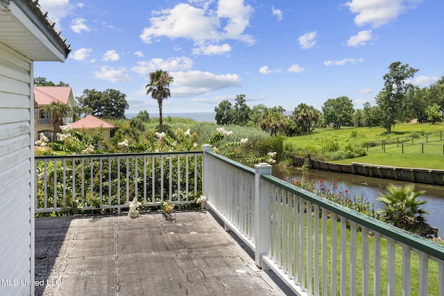 balcony featuring a water view